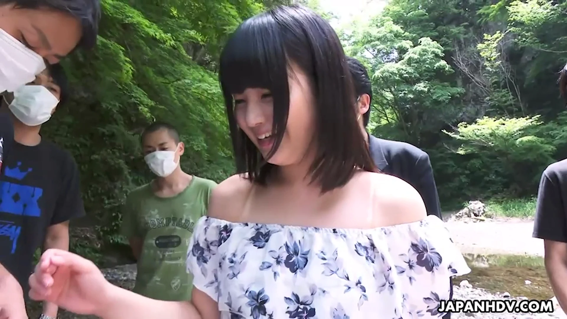 Tsuna Kimura is outdoors with a group of horny men that want their cocks sucked